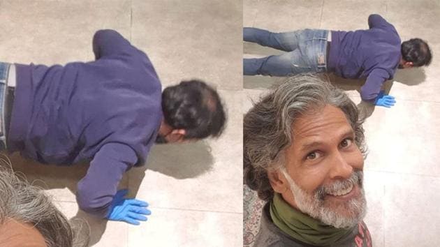 Milind Soman clicks a selfie with fan who is seen doing pushups.