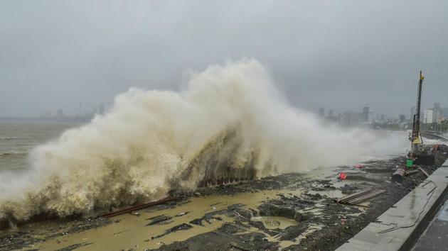 Sea waves crash ashore during high tide and heavy monsoon rain, at Marine Drive in Mumbai on August 4. Maharashtra cabinet minister Aaditya Thackeray, who visited several areas in the city, said this is probably the heaviest rains Mumbai has seen in a “12-hour span,” PTI reported. (Mitesh Bhuvad / PTI)