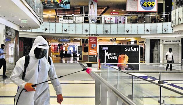 Disinfection process of common areas of Westend Mall in Aundh, Pune, being undertaken on August 3.(HT PHOTO)