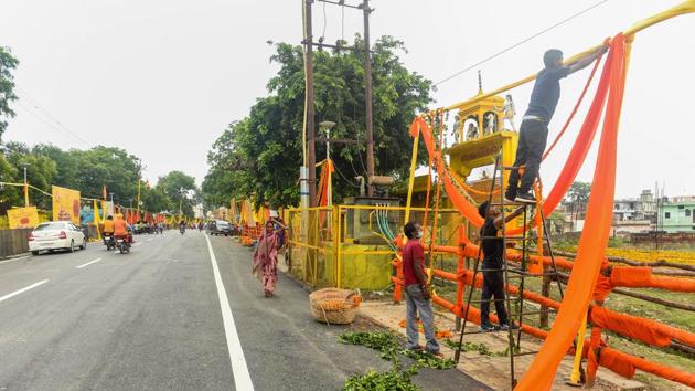 Workers decorate an area ahead of the groundbreaking ceremony of Ram temple, in Ayodhya on Tuesday.(PTI Photo)