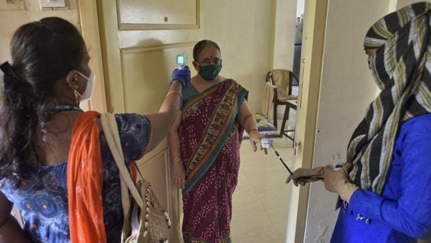 Health care staff check the temperature and pulse rate of people in a residential society in Mumbai’s Goregaon on August 3. The country has been recording more than 50,000 Covid-19 cases daily since July 30 and has added more than 2 lakh infections since the beginning of this August. The number of active cases stands at 586,244 and the cumulative tally is at 1,908,254 as of August 5. (Satyabrata Tripathy / HT Photo)