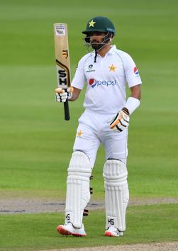Pakistan's Babar Azam reaches 50 runs during the first day of the first Test cricket match between England and Pakistan at Old Trafford in Manchester, northwest England on August 5, 2020. (Photo by Dan MULLAN / POOL / AFP) / RESTRICTED TO EDITORIAL USE. NO ASSOCIATION WITH DIRECT COMPETITOR OF SPONSOR, PARTNER, OR SUPPLIER OF THE ECB (AFP) Pakistan's Babar Azam reaches 50 runs during the first day of the first Test cricket match between England and Pakistan at Old Trafford in Manchester, northwest England on August 5, 2020. (Photo by Dan MULLAN / POOL / AFP) / RESTRICTED TO EDITORIAL USE. NO ASSOCIATION WITH DIRECT COMPETITOR OF SPONSOR, PARTNER, OR SUPPLIER OF THE ECB (AFP)