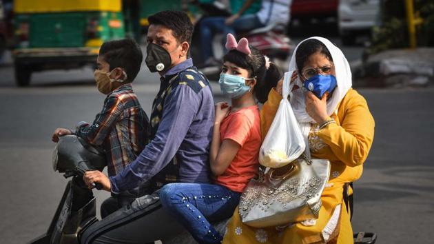 A family of four seen wearing face masks while commuting on a scooter in Daryaganj, New Delhi on August 3. “Active cases left in Delhi less than 10,000 today. No of deaths have come down to 12 today. I am proud of you, Delhiites. Your ‘Delhi model’ being discussed everywhere. But we should not get complacent and take all precautions,” tweeted Delhi chief minister Arvind Kejriwal. (Sanchit Khanna / HT Photo)