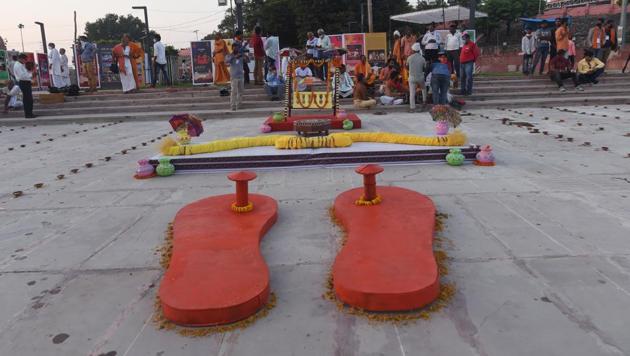 A large 'Khadau' (wooden slippers), bow and arrow, and palanquin put on display at Naya Ghat on the eve of the groundbreaking ceremony of the Ram Mandir in Ayodhya on Tuesday. (PTI Photo)