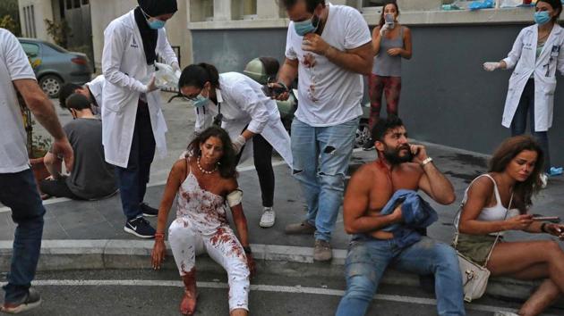 People wounded in the explosion pictured outside a hospital in Beirut on August 4. Scores of people were missing, with relatives pleading on social media for help locating loved ones, AP reported. An Instagram page called “Locating Victims Beirut” sprang up with photos of missing people, and radio presenters read the names of missing or wounded people throughout the night. (Ibrahim Amro / AFP) People wounded in the explosion pictured outside a hospital in Beirut on August 4. Scores of people were missing, with relatives pleading on social media for help locating loved ones, AP reported. An Instagram page called “Locating Victims Beirut” sprang up with photos of missing people, and radio presenters read the names of missing or wounded people throughout the night. (Ibrahim Amro / AFP)