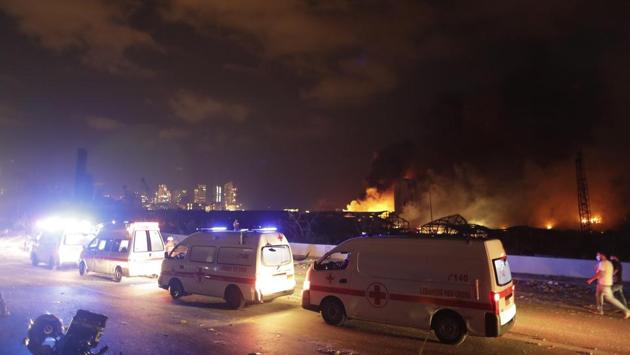 Ambulances drive past the explosion site in Beirut on August 4. AP reported that messages of support have poured in from around the world for Lebanon, whose economy was already on its knees after defaulting on sovereign debt earlier this year. The US, France, Qatar, Iran and even Lebanon’s long-standing enemy Israel have offered to send aid. (Hassan Ammar / AP) Ambulances drive past the explosion site in Beirut on August 4. AP reported that messages of support have poured in from around the world for Lebanon, whose economy was already on its knees after defaulting on sovereign debt earlier this year. The US, France, Qatar, Iran and even Lebanon’s long-standing enemy Israel have offered to send aid. (Hassan Ammar / AP)