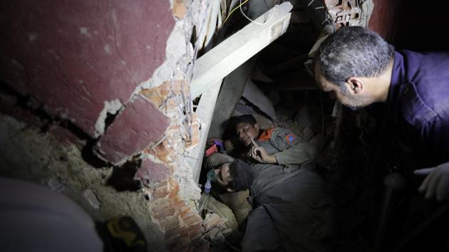 Lebanese soldiers search for survivors after a massive explosion in Beirut on August 5. George Kettaneh, head of Lebanon’s Red Cross told Reuters that at least 100 people were killed and more than 4,000 were wounded. “We are still sweeping the area. There could still be victims. I hope not,” he said. (Hassan Ammar / AP) Lebanese soldiers search for survivors after a massive explosion in Beirut on August 5. George Kettaneh, head of Lebanon’s Red Cross told Reuters that at least 100 people were killed and more than 4,000 were wounded. “We are still sweeping the area. There could still be victims. I hope not,” he said. (Hassan Ammar / AP)