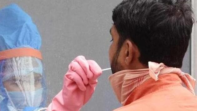 A health worker collects swabs for rapid testing in Hindpirhi locality, a coronavirus containment zone in Ranchi. (HT photo) A health worker collects swabs for rapid testing in Hindpirhi locality, a coronavirus containment zone in Ranchi. (HT photo)