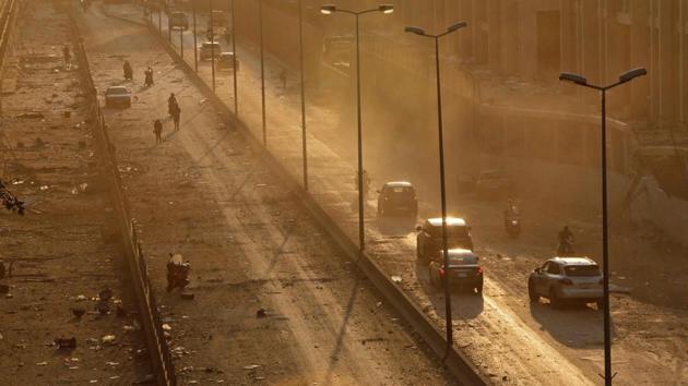 Debris is seen on a main road in Beirut at sunset following the explosion in Beirut on August 4. Interior Minister Mohammed Fahmi told a local TV station that it appeared the blast was caused by the detonation of more than 2,700 tons of ammonium nitrate that had been stored in a warehouse at the dock ever since it was confiscated from a cargo ship in 2014. (Marwan Tahtah / AFP) Debris is seen on a main road in Beirut at sunset following the explosion in Beirut on August 4. Interior Minister Mohammed Fahmi told a local TV station that it appeared the blast was caused by the detonation of more than 2,700 tons of ammonium nitrate that had been stored in a warehouse at the dock ever since it was confiscated from a cargo ship in 2014. (Marwan Tahtah / AFP)