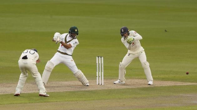 Pakistan's Shan Masood, center, plays a shot during the first day of the first cricket Test match between England and Pakistan at Old Trafford in Manchester, England, Wednesday, Aug. 5, 2020.(AP)