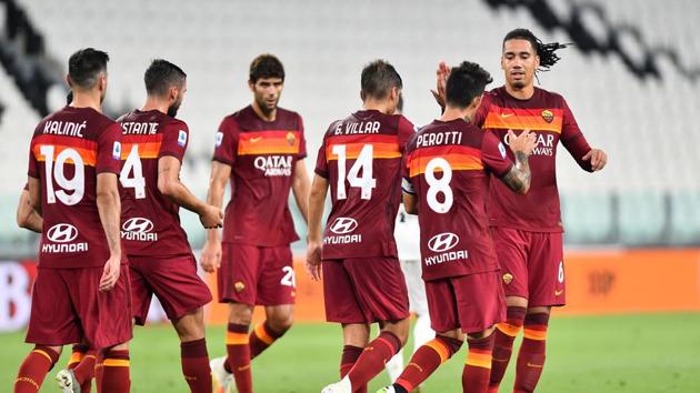 AS Roma's Diego Perotti celebrates scoring their second goal with teammates. (REUTERS)