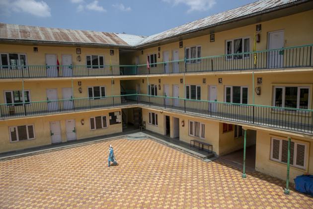 A woman walks inside an empty school that has remained closed for the past four months because of the coronavirus pandemic in Srinagar, Jammu and Kashmir, Wednesday, July 22, 2020. (AP) A woman walks inside an empty school that has remained closed for the past four months because of the coronavirus pandemic in Srinagar, Jammu and Kashmir, Wednesday, July 22, 2020. (AP)