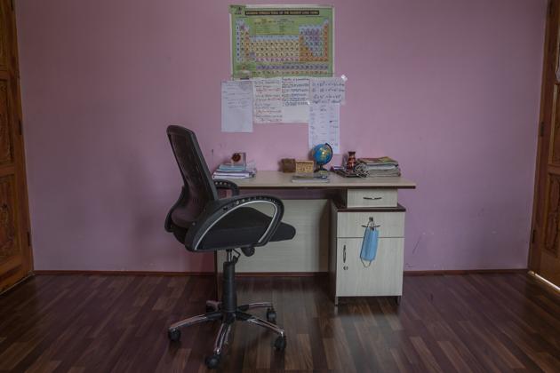 A face mask hangs on a study table of a Kashmiri student in Srinagar, Jammu and Kashmir, Friday, July 18, 2020. Experts say lack of formal schooling during the lockdown could have a serious psychological and emotional impact on the children. With no opportunity to be with friends, many homebound students are struggling to reimagine the school experience as parents take over the role of teachers. (AP) A face mask hangs on a study table of a Kashmiri student in Srinagar, Jammu and Kashmir, Friday, July 18, 2020. Experts say lack of formal schooling during the lockdown could have a serious psychological and emotional impact on the children. With no opportunity to be with friends, many homebound students are struggling to reimagine the school experience as parents take over the role of teachers. (AP)