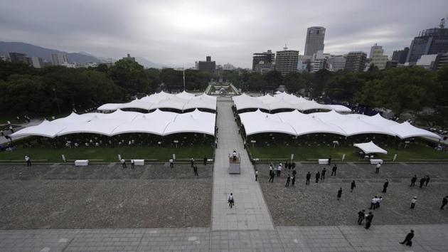 Participants gather at the Hiroshima Peace Memorial Park before the ceremony on August 6. Though thousands usually pack the Peace Park to pray, sing and offer paper cranes as a symbol of peace, this year entrance was sharply limited and only survivors and their families could attend the memorial ceremony due to the coronavirus (COVID-19) outbreak. (Eugene Hoshiko / AP)