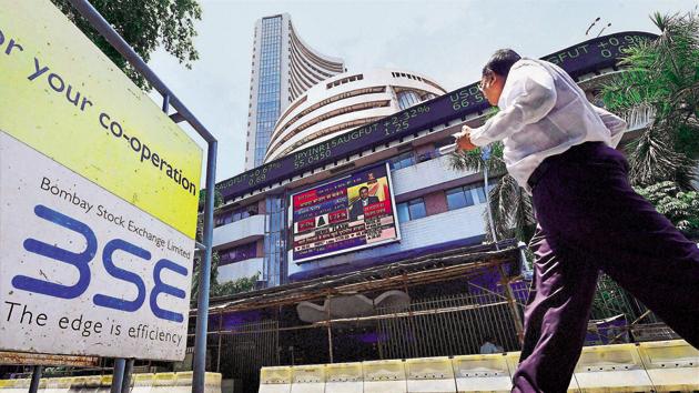 An investor watching stock prices at the Bombay Stock Exchange (BSE) in Mumbai.(PTI File Photo)
