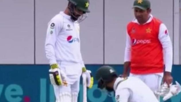 Screengrab of action from Day 2 of 1st Test between Pakistan and England when former Pakistan captain brought in shoes and drinks as 12th man.(Twitter)