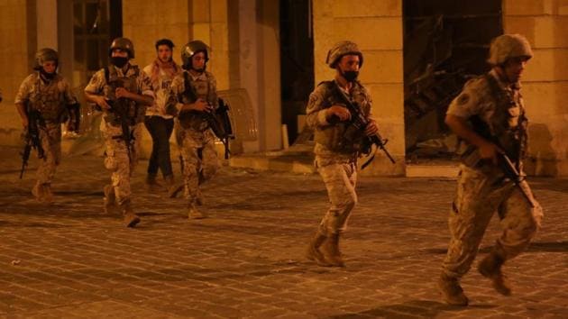 Lebanese soldiers deployed during the protest in Beirut on August 7. Grief turned to anger and people took to the streets when the death toll rose to 149 and over 5,000 were injured due to the explosion on August 6. (Mohamed Azakir / REUTERS)