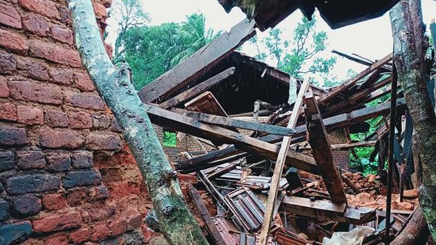 A house damaged by the landslide is seen in Idukki on August 7. According to PTI, cooking utensils buried in mud, asbestos and tin sheets strewn around were all that could be seen at the area, which was the habitation of around 80 workers. (ANI)