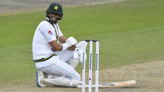 Pakistan's Shan Masood reacts in pain after he was hit on his elbow on a delivery by England's Stuart Broad. (AP)