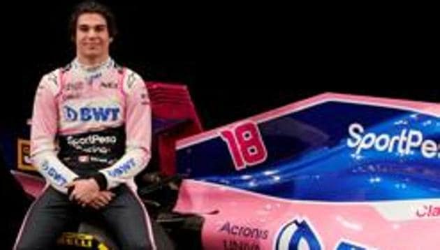 SportPesa Racing Point F1 Team driver Lance Stroll poses after unveiling the team's new car livery at a pre-season launch event at the Canadian International AutoShow in Toronto, Ontario, Canada, February 13, 2019.(REUTERS)