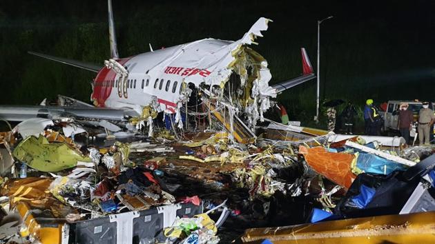 The broken Air India Express Boeing 737 repatriation flight lies amid debris in Kozhikode, Kerala.(HT Photos)
