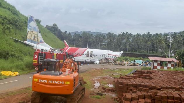 The mangled remains of the Air India Express flight that split into two after overshooting the runway in Kozhikode on Friday night.(PTI)