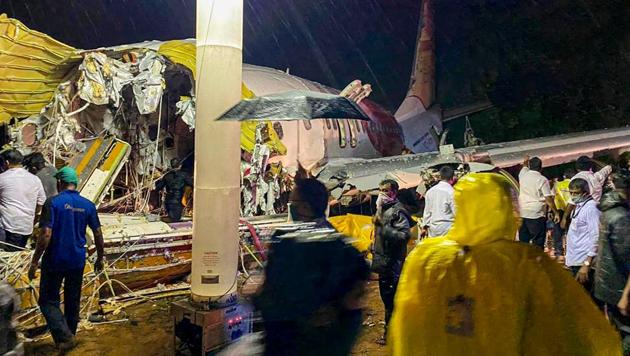 Rescue operation site after an Air India Express flight with passengers on board en route from Dubai skidded off the runway while landing, at Karippur in Kozhikode on Friday.(PTI Photo) Rescue operation site after an Air India Express flight with passengers on board en route from Dubai skidded off the runway while landing, at Karippur in Kozhikode on Friday.(PTI Photo)