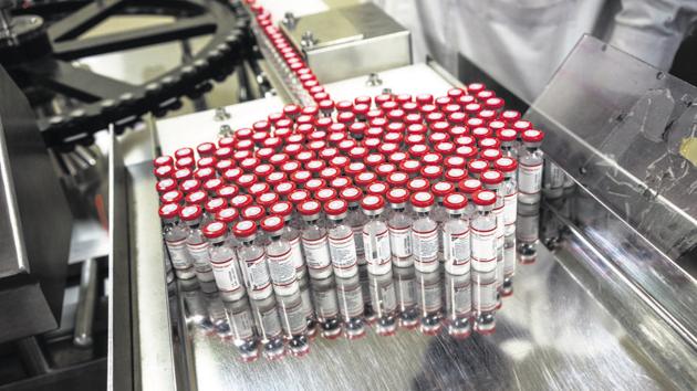 Vaccine vials exit a vaccine vial monitor labelling machine at the Serum Institute of India Ltd. pharmaceutical plant in Pune. (Bloomberg File Photo) Vaccine vials exit a vaccine vial monitor labelling machine at the Serum Institute of India Ltd. pharmaceutical plant in Pune. (Bloomberg File Photo)