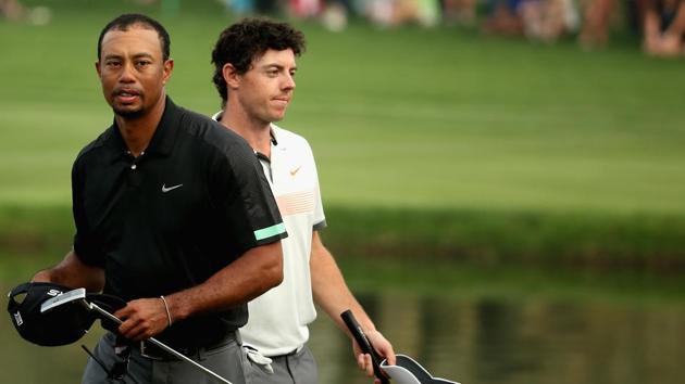 Rory McIlroy and Tiger Woods walk off the 18th green during the second round of the 2014 Omega Dubai Desert Classic.(Getty Images) Rory McIlroy and Tiger Woods walk off the 18th green during the second round of the 2014 Omega Dubai Desert Classic.(Getty Images)