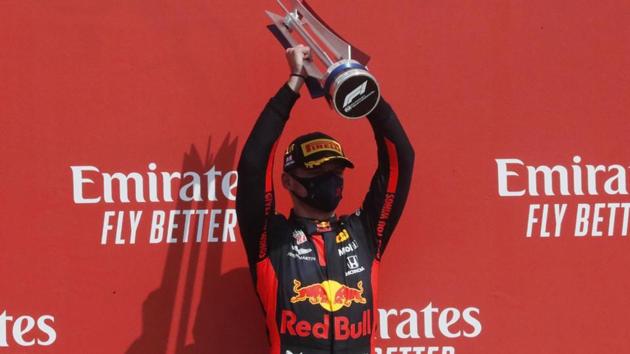 Red Bull’s Max Verstappen celebrates his win on the podium after the race.(Reuters)