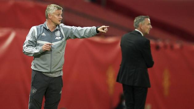 Manchester United's manager Ole Gunnar Solskjaer gestures during the Europa League round of 16 second leg soccer match between Manchester United and LASK at Old Trafford in Manchester, England, Wednesday, Aug. 5, 2020.(AP)