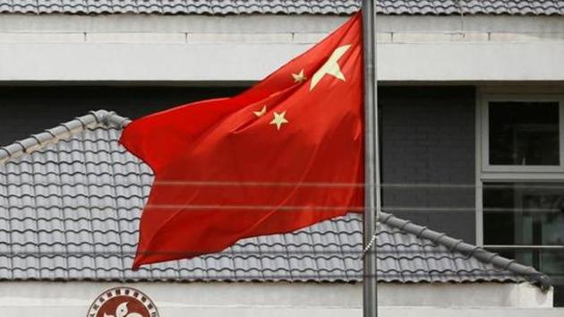 The Chinese flag flutters at the office of the Government of the Hong Kong Special Administrative Region in Beijing.(Reuters File Photo)