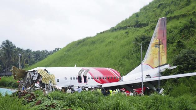 According to officials from Airports Authority of India (AAI), the aircraft touched down near a taxiway that is around 1,000 metres from the beginning of the runway, before breaking up into two pieces. Kozhikode airport has a tabletop runway.(AP Photo)