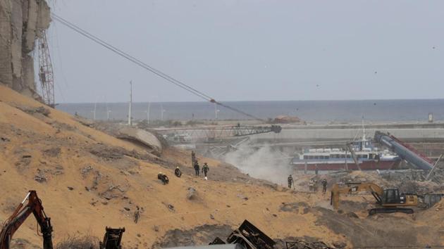 Rescue teams search for missing people near the site of last Tuesday's explosion that hit the seaport of Beirut, Lebanon. (AP) Rescue teams search for missing people near the site of last Tuesday's explosion that hit the seaport of Beirut, Lebanon. (AP)