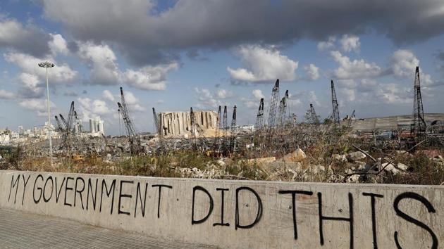 Words are written by Lebanese citizens in front of the scene of Tuesday's explosion that hit the seaport of Beirut, Lebanon.(AP)