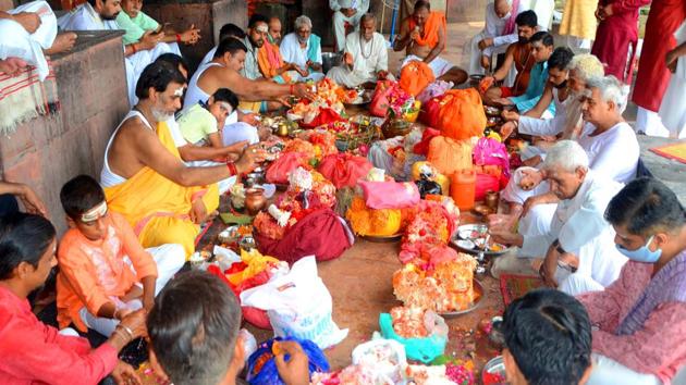 Pilgrims doing Shrawani Pooja at the Kusha Vrat Ghat, in Haridwar on Monday.(ANI photo)