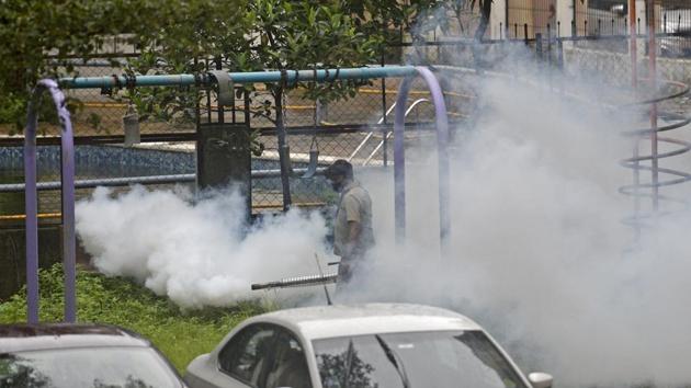 A Brihanmumbai Municipal Corporation (BMC) worker fumigates an area in Goregaon, Mumbai on August 7. In the state capital Mumbai, 1,304 new cases and 58 deaths were reported for August 8. The total number of Covid-19 cases in the city now stands at 122,316 and the death toll has risen to 6,751. (Satyabrata Tripathy / HT Photo)