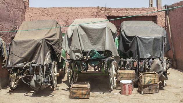 Empty horse-drawn carriages are covered in a stable in Marrakech, Morocco. (AP Photo/Mosa'ab Elshamy)