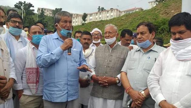 Former Uttarakhand Chie fMinister Harish Rawat addressing his supporters during his visit to Gairsain on Sunday.(HT PHOTO)