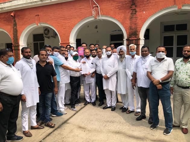 Congress workers at the Ambala DC’s office.(HT Photo)