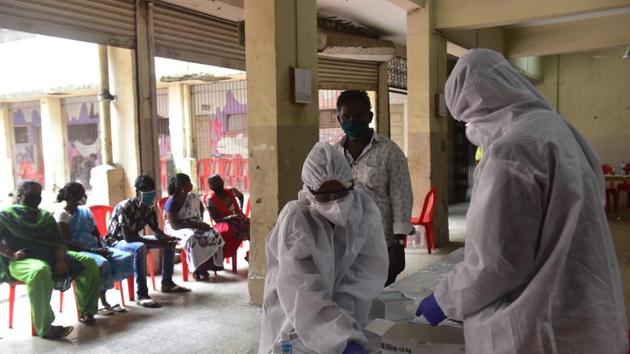 BMC medical staff conducts the Integen Test of BMC employees at Khumbhar Wada in Mumbai on Monday. (Anshuman Poyrekar/HT Photo) BMC medical staff conducts the Integen Test of BMC employees at Khumbhar Wada in Mumbai on Monday. (Anshuman Poyrekar/HT Photo)