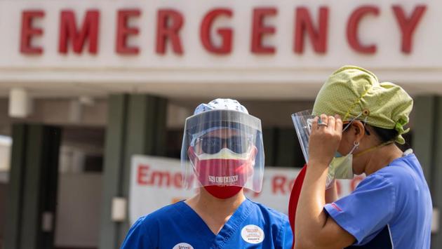 Healthcare workers at Fountain Valley Regional Hospital during a rally outside their hospital for safer working conditions during the coronavirus outbreak in California on August 6. The United States on August 9 reached the extraordinary milestone of five million coronavirus cases. (Mike Blake / REUTERS)