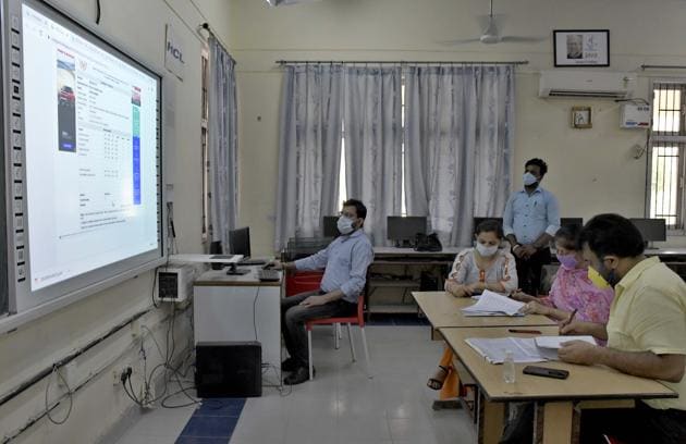 Committee members conducting online counselling at SCD Government College in Ludhiana on Monday.(Harsimar Pal SIngh/HT)