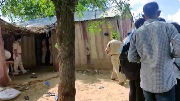 Police personnel at the spot where 11 members of a family that had migrated from Pakistan, were found dead at their home in Lodata village of Jodhpur district on Sunday.(ANI)