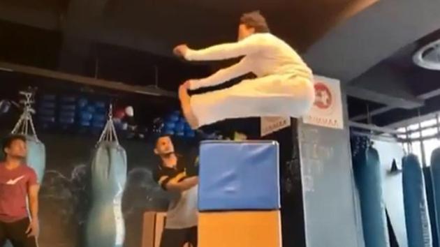Tiger Shroff performs a high jump.