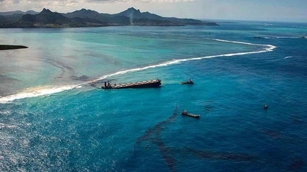 An aerial photo shows oil leaking from the MV Wakashio, a bulk carrier ship that ran aground off the coast of Mauritius.
