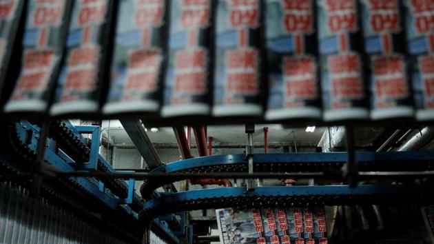 Copies of the Apple Daily newspaper, published by Next Media Ltd, with a headline "Apple Daily will fight on" after media mogul Jimmy Lai Chee-ying, founder of Apple Daily was arrested by the national security unit, are seen at the company's printing facility, in Hong Kong on August 11, 2020.(Reuters Photo)