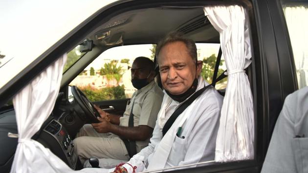 Chief Minister Ashok Gehlot interacts with media persons outside state hangar after his arrival from Jaisalmer, in Jaipur.(HT file photo)