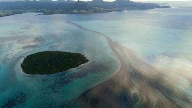 Oil leaking off the southeast coast of Mauritius on August 10. The ship, MV Wakashio, is owned by Nagashiki Shipping and operated by Mitsui OSK Lines Ltd. “We will do our utmost towards resolving the situation quickly,” the company told Reuters in a statement. (Mauritian Wildlife Foundation Ministry via AP)