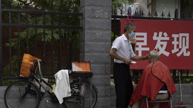 China has largely brought its domestic epidemic under control, but sporadic outbreaks and a summer of severe flooding have exacerbated the economic fallout.(AP Photo)